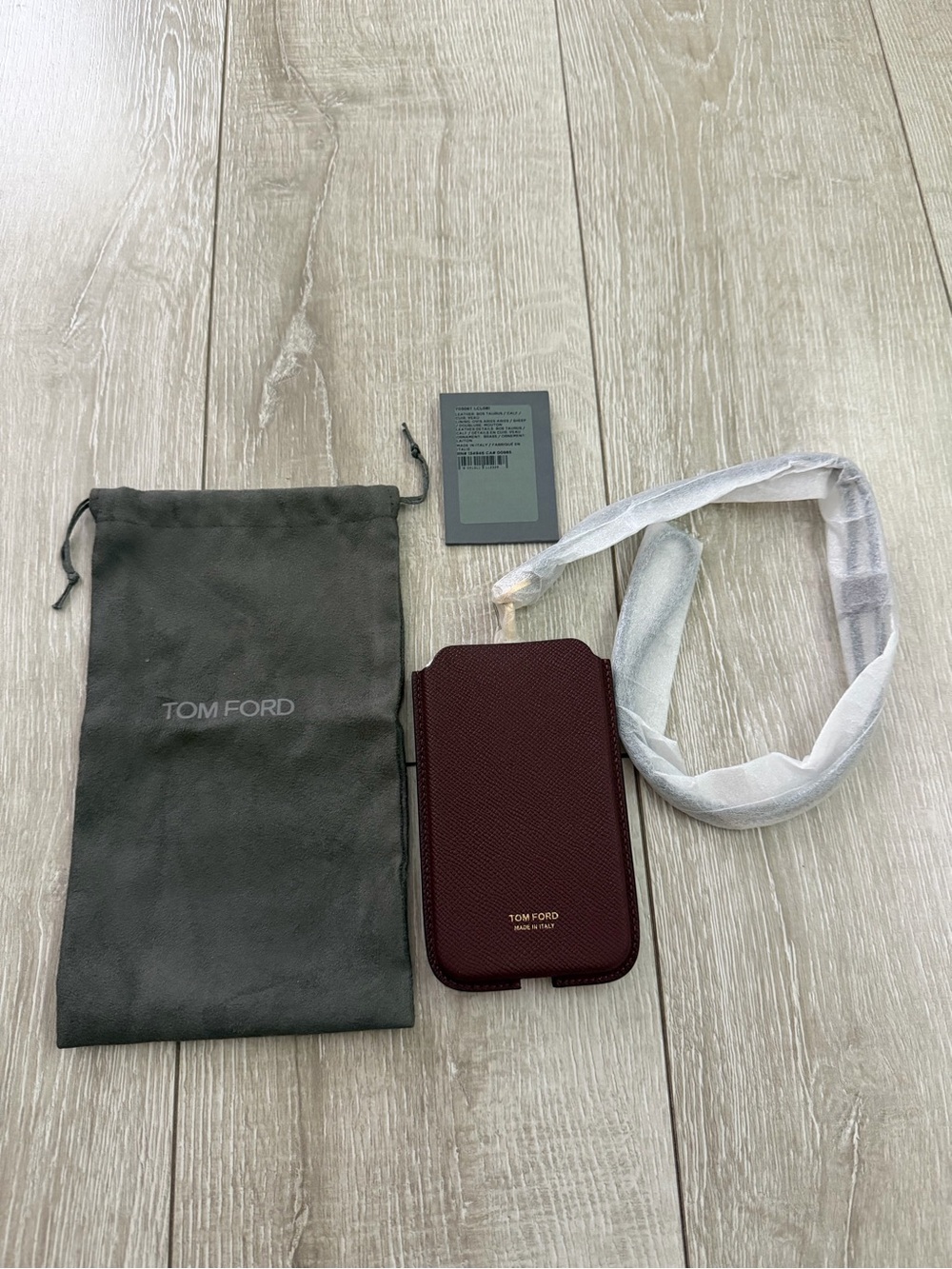 Tom Ford Dark Burgundy Textured Leather Phone Case with lanyard